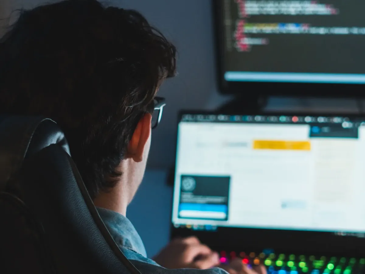 Technician checking data on a computer